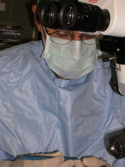 Surgeon holding a needle-holder during eye surgery